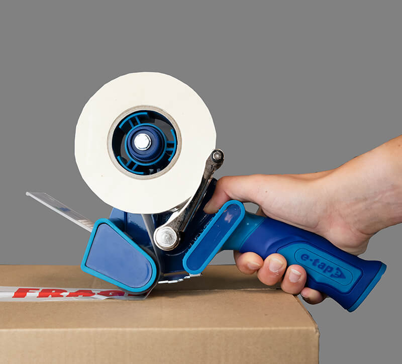 Using a handheld tape dispenser